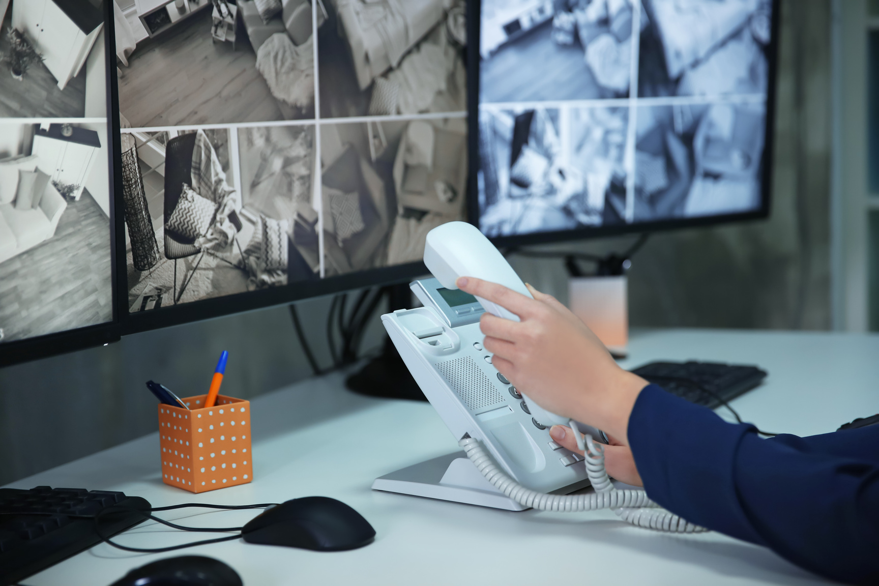 Security Guard Using Telephone in Surveillance Room